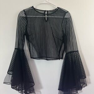 Gorgeous black see through top with long flare sleeves.